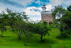 Great Captain Island Light Among Trees on Hilltop
